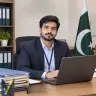 علی حیدر، رجسٹریشن اور ایڈمیشن انچارج، گورنمنٹ کالج یونیورسٹی لاہور، اپنے دفتری میز پر